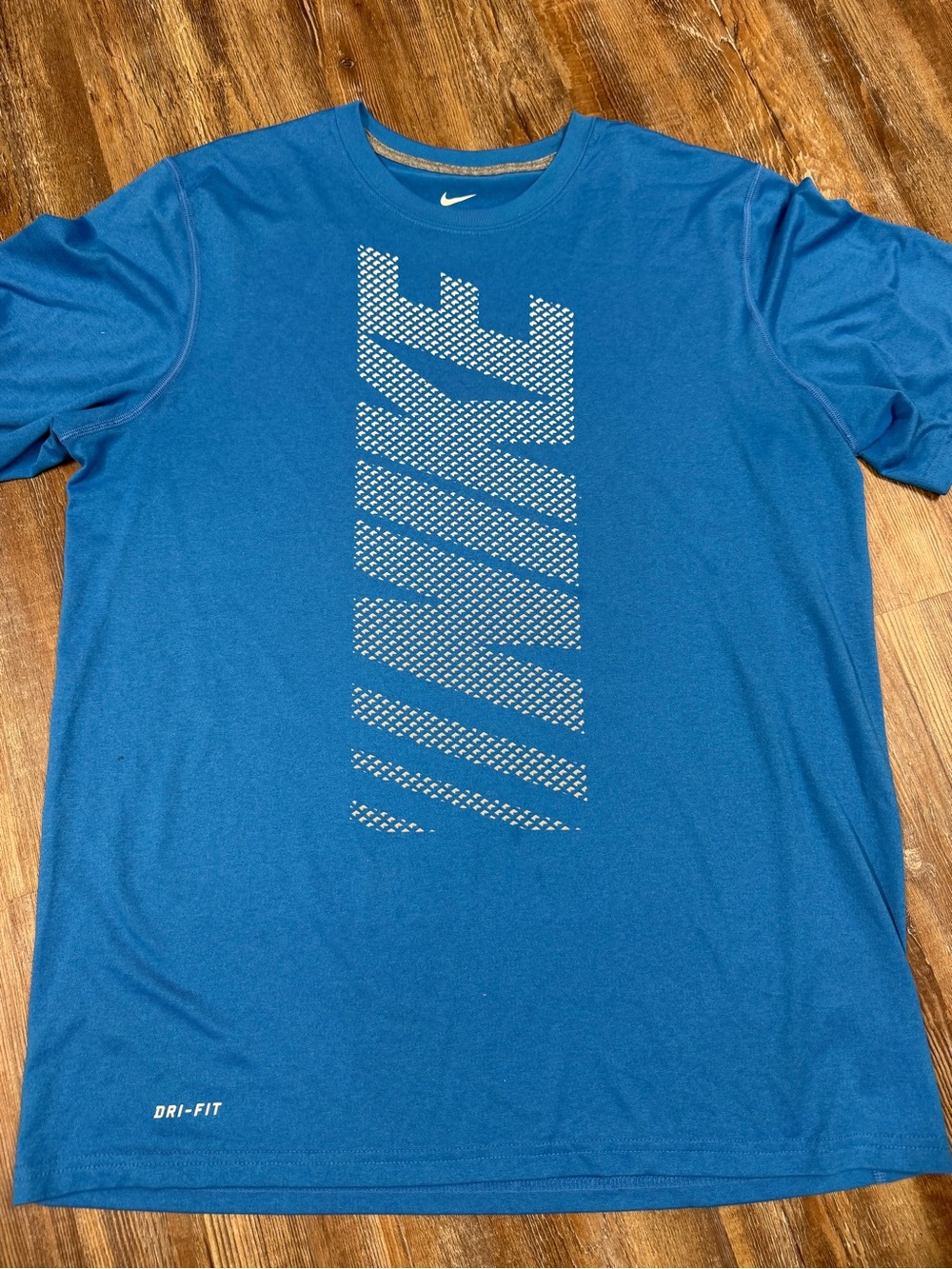 Nike Dri-Fit blue t-shirt with white Nike logo made of dots, size L